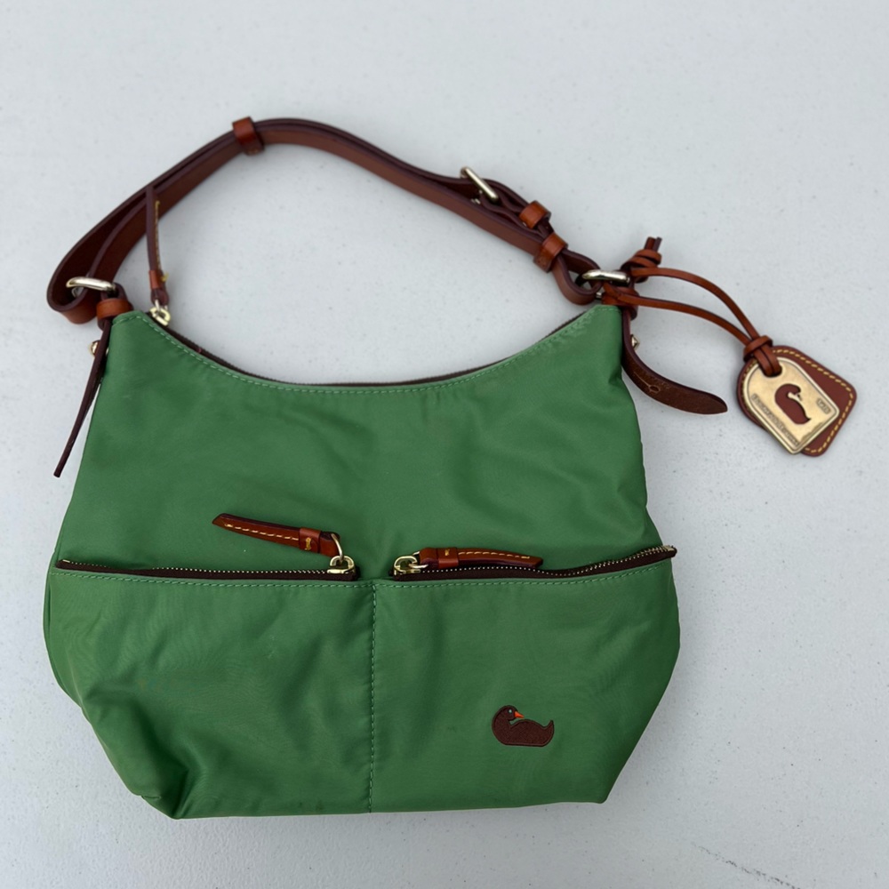 Iconic green Dooney & Bourke Bag with duck neon pink shoulder leather straps